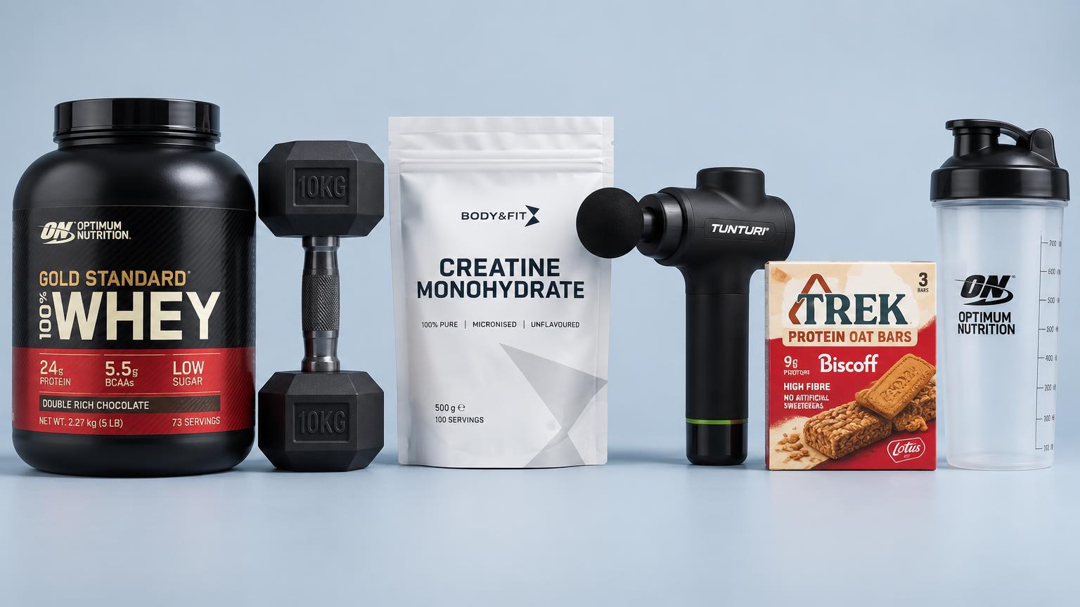 Eiwitpoeder, dumbbell, creatine, massagepistool, eiwitrepen en shaker